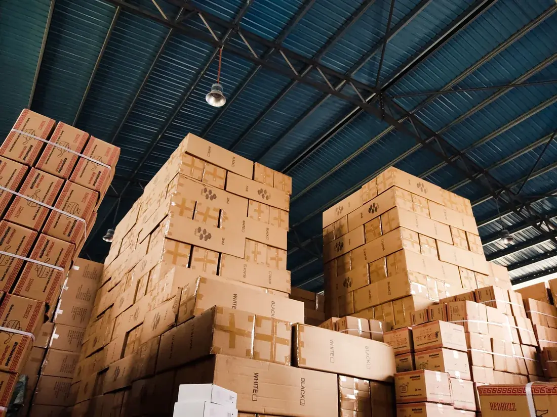 Stacks of cartons inside a distribution warehouse